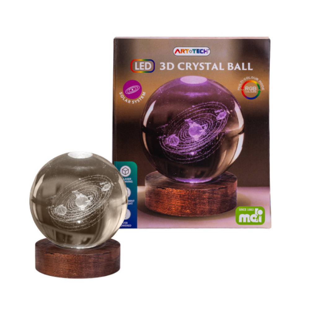 3D crystal ball with LED lighting on a wooden stand next to its packaging box.