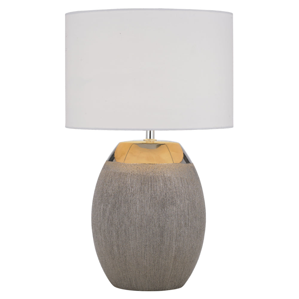 Table lamp with a textured gray base and white shade on a white background