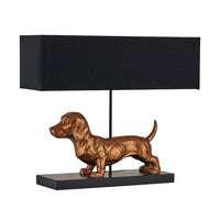 Dog-shaped table lamp with a black rectangular shade on a white background