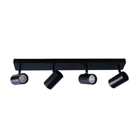 Black ceiling light fixture with four cylindrical lights on a white background