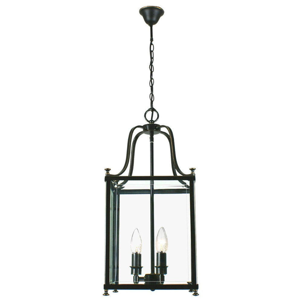 Black metal pendant light with clear glass panels on a white background