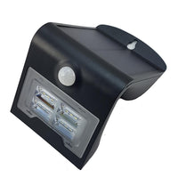 Black outdoor motion sensor light on a white background