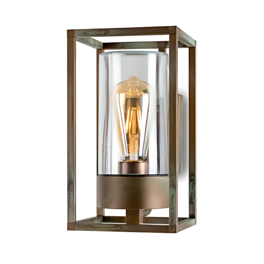 Decorative wall light fixture with clear glass and bronze metal frame on a white background