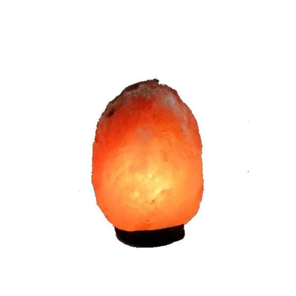 Himalayan salt lamp with a warm glow on a white background